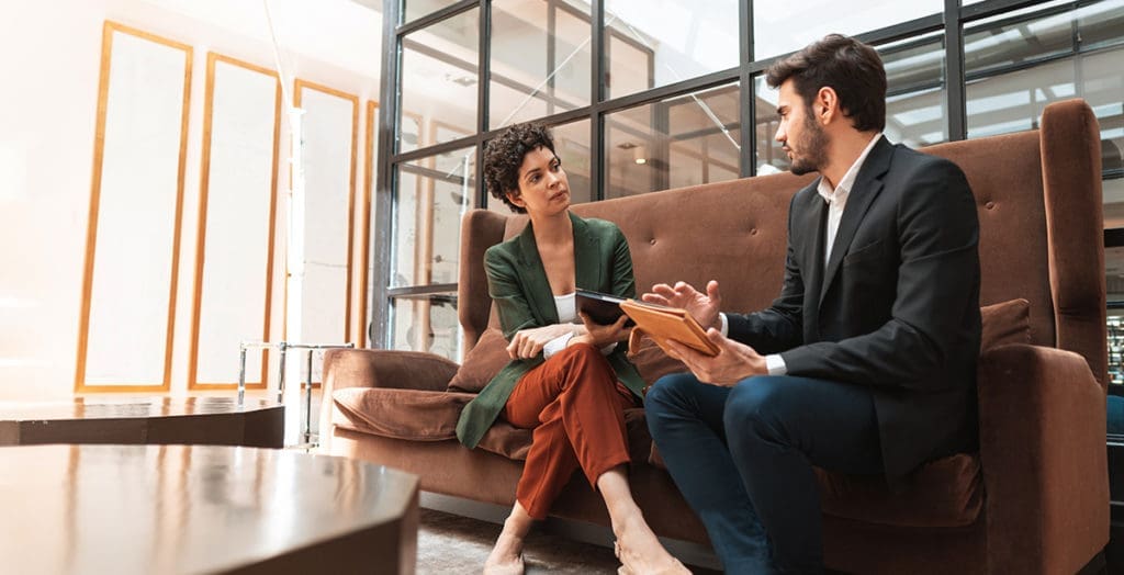 Man interviewing woman