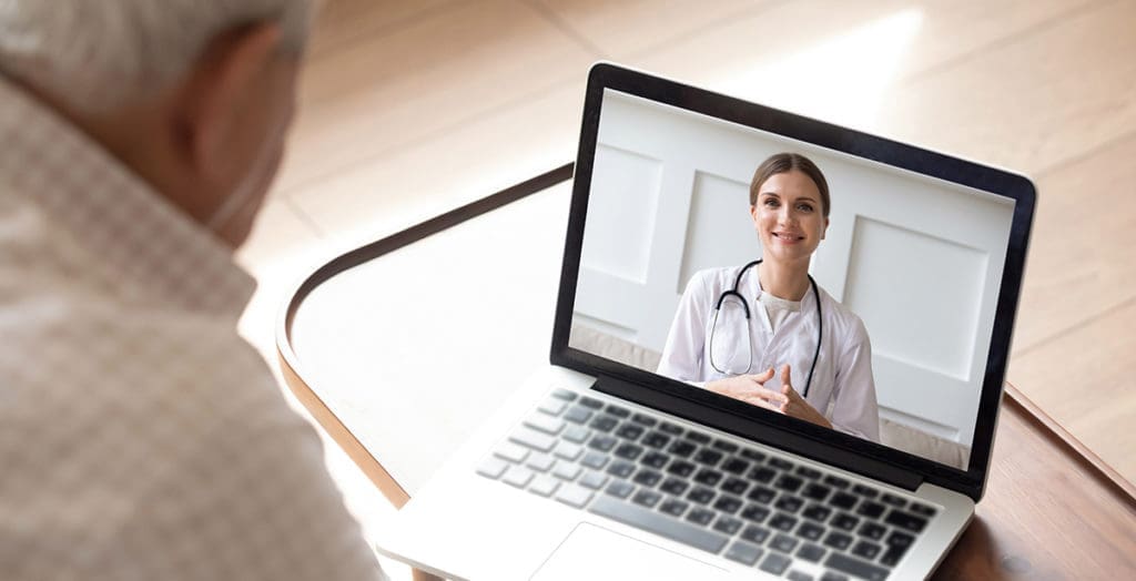 Man talking to his doctor via the internet