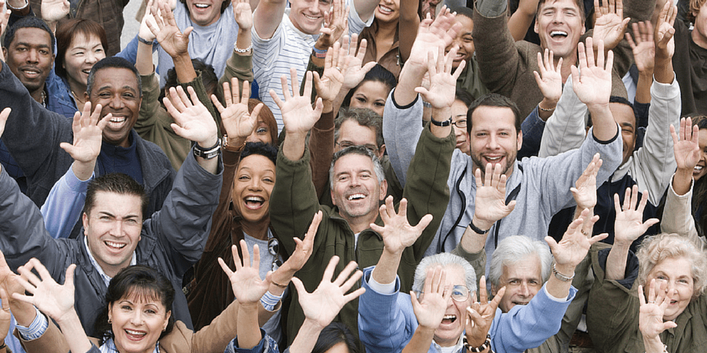 Group of people holding up their hands