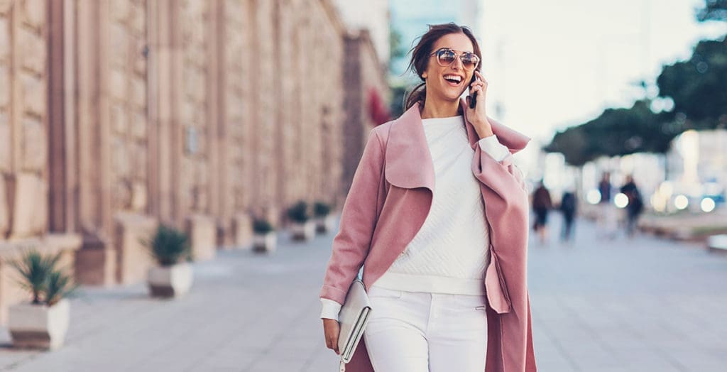 Woman smiling and talking on the phone