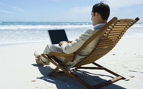 Man working from the beach