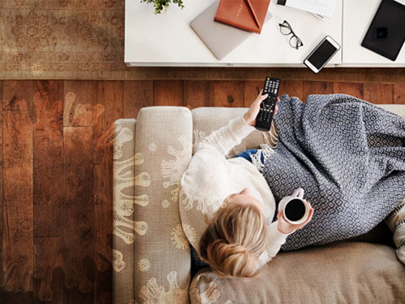 Woman on couch watching tv