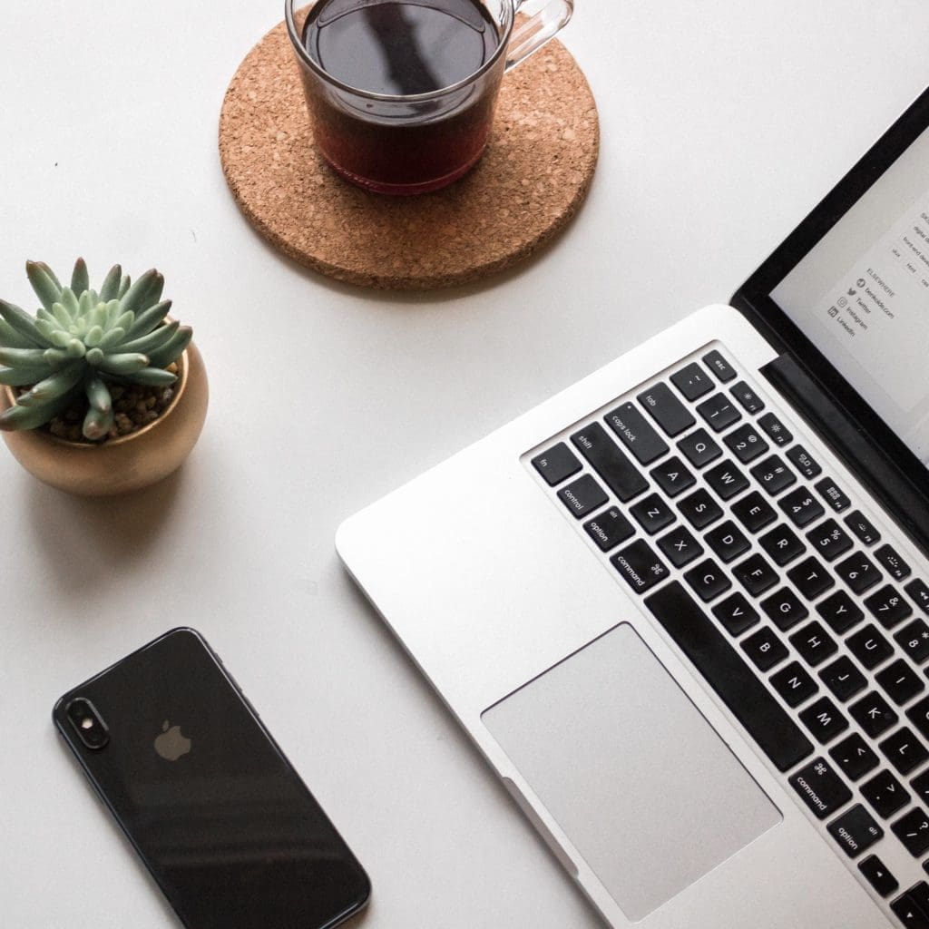 Desk with laptop and phone