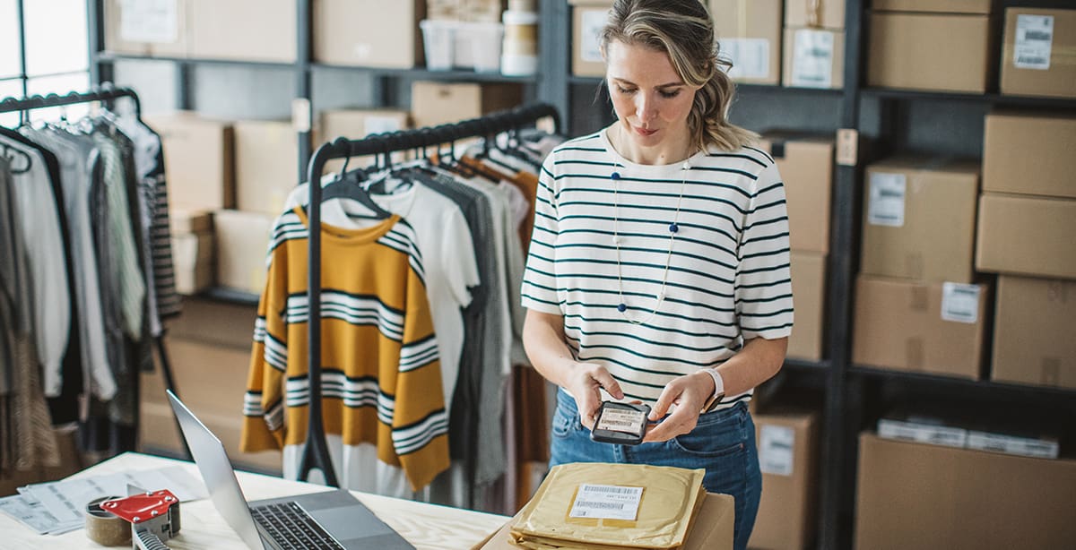 Woman preparing item for shipping